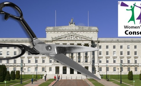 Stormont parliament buildings with a pair of giant scissors in the foreground.